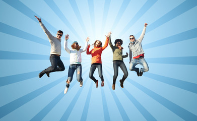 smiling friends in sunglasses jumping high