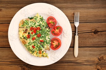 Porcini mushrooms omelette with tomatoes and scallion with white