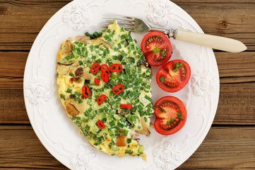Porcini mushrooms omelette with tomatoes and scallion with white