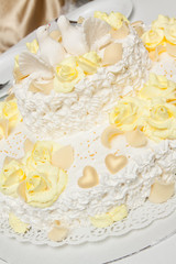 Tasty wedding cake with doves.