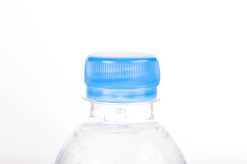 Close-up cap of plastic bottle on white background