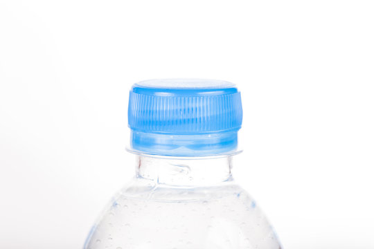 Close-up cap of plastic bottle on white background
