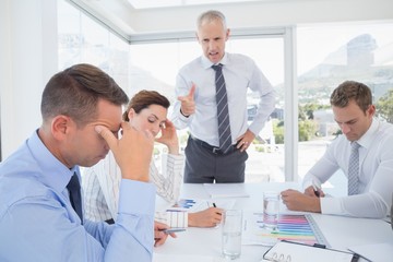 Businessman yelling at his team