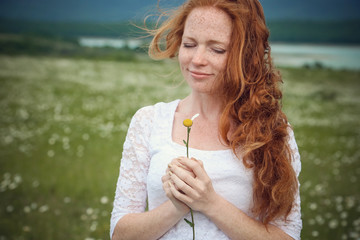 Beautiful woman enjoying field, harmony concept