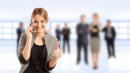 Young business woman talking on smartphone