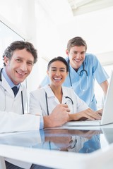 Team of doctors smiling at camera 