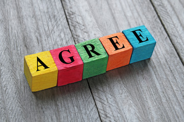 word agree on colorful wooden cubes - obrazy, fototapety, plakaty