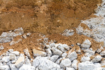 .Break concrete layer of soil