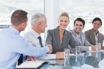 Business people shaking their hands 
