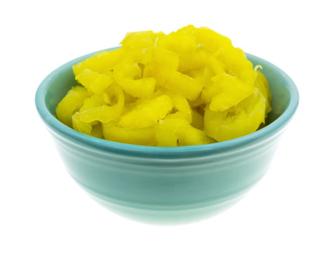 Banana peppers in a bowl on a white background