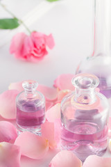 Obraz na płótnie Canvas Rose petals and essential rose perfume