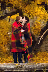 Happy young couple in love meeting on the autumn leaf