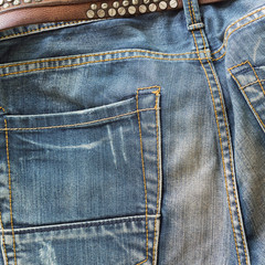 blue jeans with brown leather belt