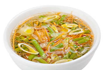 Fresh vegetable soup made of green bean, carrot, potato and leek