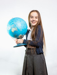 happy schoolgirl posing with globe against white background