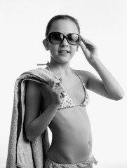 Black and white portrait of girl posing with beach towel