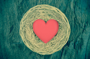 single red heart shape in basket