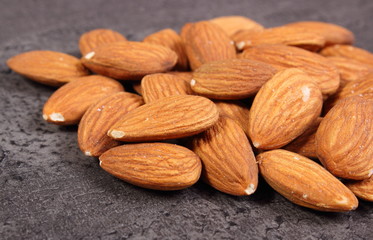 Heap of almonds on concrete structure