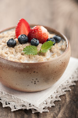 Breakfast oatmeal with milk and berries