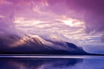 Foto op Canvas Landscape with mountains and clouds © olenatur