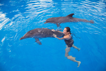 Girl swimming with Dolphin
