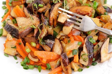 Porcini mushrooms ragout with carrot, scallion and thyme in whit