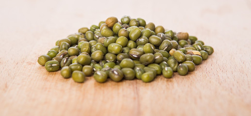 Mung beans on wooden board