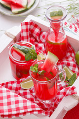  Watermelon lemonade in bottles and a glass