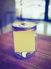 coin in money jar in vintage color