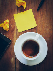 cup of coffee and short note paper