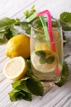 Delicious homemade lemonade in a glass close-up, vertical
