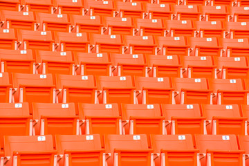 Fototapeta premium stadium, red seats on stadium steps bleacher 