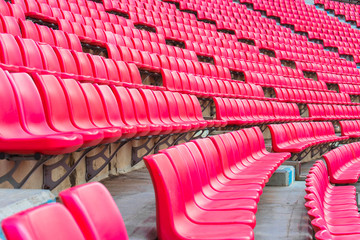 Obraz premium stadium, red seats on stadium steps bleacher 