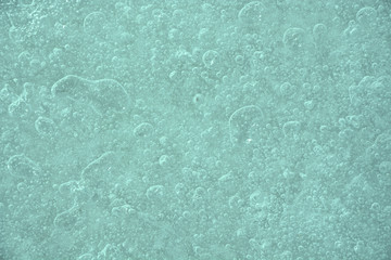 Icy background with bubbles. Closeup view, winter season