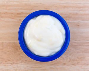 Pineapple yogurt in a blue dish on table