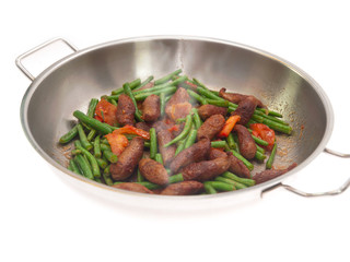 fried merguez sausages with green beans and tomatoes