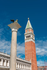 Fototapeta na wymiar Campanile tower at Piazza San Marco and gondolers, Venice, Italy