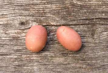 Potatoes on wooden background