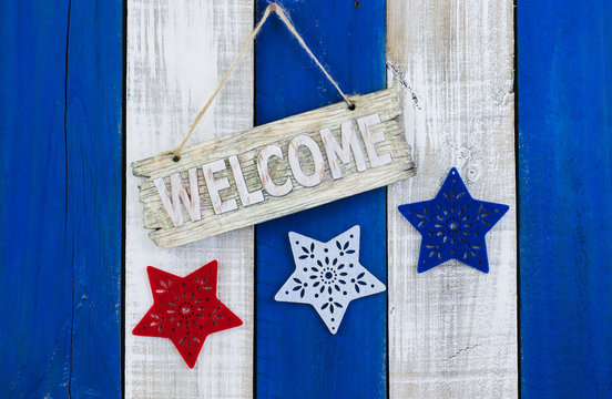 Welcome sign with stars hanging on wood background
