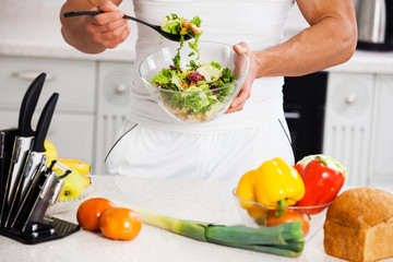 man preparing salad