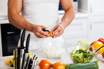 man cutting vegetables