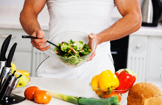 man cutting vegetables