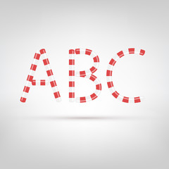 Candy cane font. Letters made with sweet candies. Letters A, B, C.