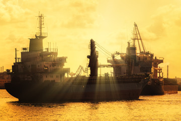 Commercial cargo  ships at sunset