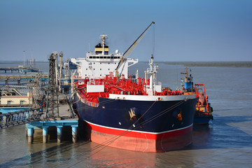 chemical tanker in the port for loading and bunkering operation - 84925529
