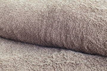 Fototapeta na wymiar Close - up Fold of brown towel