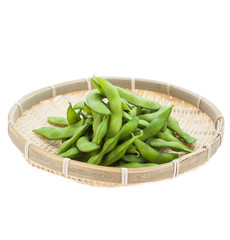 Edamame soy beans in bamboo tray on white background