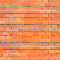 Red brick stone wall seamless background and texture