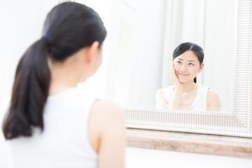 young asian woman in bathroom