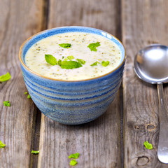 Bowl of broccoli and cheddar cheese soup